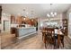 Inviting open-concept space features a kitchen island and a cozy dining area at 2941 Marlberry Ln, Clermont, FL 34714