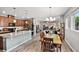 This open-concept living space combines kitchen, dining area, and seamlessly connected living room at 2941 Marlberry Ln, Clermont, FL 34714