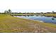 Scenic pond view from the home's backyard provides a tranquil backdrop and enhances outdoor enjoyment at 2941 Marlberry Ln, Clermont, FL 34714