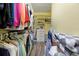 Functional walk-in closet features custom shelving and ample storage space for an organized wardrobe at 2941 Marlberry Ln, Clermont, FL 34714