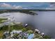 Breathtaking aerial view of the property, showcasing its proximity to the serene lake and surrounding landscape at 3241 Downs Cove Rd, Windermere, FL 34786