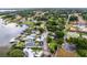 Neighborhood aerial view showcasing lakefront homes with boat docks and lush landscaping at 3241 Downs Cove Rd, Windermere, FL 34786