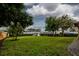 Expansive backyard featuring lush green lawn and meticulously maintained landscaping for outdoor enjoyment at 3241 Downs Cove Rd, Windermere, FL 34786
