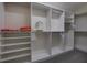 Spacious walk-in closet with organized shelving and ample hanging space at 3241 Downs Cove Rd, Windermere, FL 34786