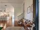 Inviting entryway with hardwood floors, a decorative bench, and an open view to the kitchen at 3241 Downs Cove Rd, Windermere, FL 34786
