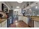 Well-equipped kitchen with stainless steel appliances, granite counters, and a view to the dining area at 3241 Downs Cove Rd, Windermere, FL 34786