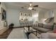 Bright, open living room featuring a comfortable sofa, bar seating and view to the kitchen and dining areas at 3241 Downs Cove Rd, Windermere, FL 34786