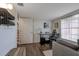 This versatile home office features wood floors, desk, wall shelving, and closet with easy stair access at 3241 Downs Cove Rd, Windermere, FL 34786