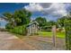 Charming backyard outbuilding nestled behind a privacy hedge, offering a secluded and functional space at 3241 Downs Cove Rd, Windermere, FL 34786