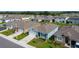 Aerial view of a residential neighborhood featuring well-maintained homes and landscaping at 3354 Aruba Way, Haines City, FL 33844
