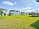 Expansive backyard featuring a lush green lawn perfect for outdoor activities and relaxation at 3354 Aruba Way, Haines City, FL 33844