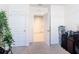 Bright bedroom with a neutral carpet, white walls, and an open doorway to another room at 3354 Aruba Way, Haines City, FL 33844