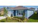 Charming home exterior featuring well-manicured landscaping and a two-car garage at 3354 Aruba Way, Haines City, FL 33844