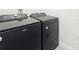 A laundry room featuring a Whirlpool washer and dryer set at 3354 Aruba Way, Haines City, FL 33844