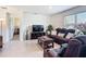 Comfortable living room with recliner sofa, tile floors, and lots of natural light at 3354 Aruba Way, Haines City, FL 33844
