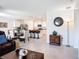 Open concept living area showcasing a modern kitchen with a large island, dining table and comfortable seating at 3354 Aruba Way, Haines City, FL 33844