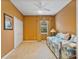 Bedroom featuring neutral carpeting and a bright window offering comfortable living at 3840 Caledonia Ave, Apopka, FL 32712