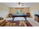 Bright game room with a pool table, a television, seating and a window at 3840 Caledonia Ave, Apopka, FL 32712