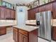 Gourmet kitchen boasts stainless steel appliances and custom cabinetry for ample storage at 3840 Caledonia Ave, Apopka, FL 32712