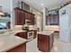 The kitchen features stainless appliances, a cooktop and adjacent dining area at 3840 Caledonia Ave, Apopka, FL 32712