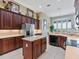 Well-equipped kitchen featuring an island, stainless appliances, and a bright breakfast nook at 3840 Caledonia Ave, Apopka, FL 32712