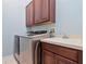 Functional laundry room with modern appliances, a sink, and ample counter space at 3840 Caledonia Ave, Apopka, FL 32712