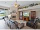 Comfortable living room with a fireplace and sliding glass doors to outdoor living at 3840 Caledonia Ave, Apopka, FL 32712