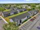 Apartment complex with well-maintained landscaping and ample parking on a sunny day at 4160 Pershing Pointe Pl # 4, Orlando, FL 32822