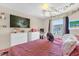 Bedroom with two white dressers, a desk, and window with a view of the outdoors for natural lighting at 4160 Pershing Pointe Pl # 4, Orlando, FL 32822