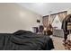 Bedroom with a black comforter, a black desk, and natural lighting from the window behind it at 4160 Pershing Pointe Pl # 4, Orlando, FL 32822