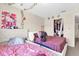 Bedroom featuring two beds, decorations on the wall, and access to the closet for extra storage at 4160 Pershing Pointe Pl # 4, Orlando, FL 32822