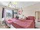 Bedroom showcasing two beds with ivy hanging from the ceiling for a visually appealing effect at 4160 Pershing Pointe Pl # 4, Orlando, FL 32822