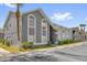 Gray condominium building exterior showcasing clean lines and large windows with lush landscaping at 4160 Pershing Pointe Pl # 4, Orlando, FL 32822