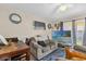 Cozy living room showcases a comfortable sofa, dining area, and a ceiling fan for added comfort at 4160 Pershing Pointe Pl # 4, Orlando, FL 32822