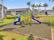 Community playground featuring colorful play equipment and an adjacent gazebo, great for and families at 4160 Pershing Pointe Pl # 4, Orlando, FL 32822