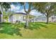 Lush backyard with well-maintained lawn, perfect for outdoor activities and relaxation at 4301 Heirloom Rose Pl, Oviedo, FL 32766