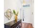 Elegant foyer featuring a console table, ornate mirror, and grand chandelier, creating a welcoming entrance at 4301 Heirloom Rose Pl, Oviedo, FL 32766