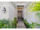Charming front entrance with a brick walkway and lovely landscaping at 4301 Heirloom Rose Pl, Oviedo, FL 32766