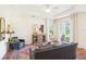 Inviting living room featuring stylish furnishings, hardwood floors, and scenic views of the outdoor scenery at 4301 Heirloom Rose Pl, Oviedo, FL 32766