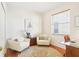 Cozy home office with two chairs, a glass desk, and natural light at 4301 Heirloom Rose Pl, Oviedo, FL 32766
