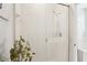White tiled shower with glass doors and shower head at 4301 Heirloom Rose Pl, Oviedo, FL 32766