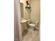Powder bathroom featuring tile floors, pedestal sink, and neutral wall paint color at 4427 Blackbird St, Kissimmee, FL 34746