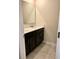 This bathroom features a dual sink vanity with modern fixtures and ample counter space at 4427 Blackbird St, Kissimmee, FL 34746