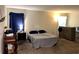 Spacious bedroom with carpeted floors and natural light at 4427 Blackbird St, Kissimmee, FL 34746
