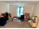 Bedroom with carpeted floors and a window at 4427 Blackbird St, Kissimmee, FL 34746