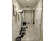 Bright entryway with tile floors, leading to the front door; features a decorative 'Gathering Rules' sign at 4427 Blackbird St, Kissimmee, FL 34746