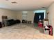 Spacious living room with tile flooring and natural light at 4427 Blackbird St, Kissimmee, FL 34746