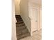 Carpeted staircase that leads to the second floor at 4427 Blackbird St, Kissimmee, FL 34746