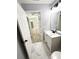 Bathroom featuring a new white vanity, black fixtures, and tile flooring at 4919 Nw 61St Ct, Ocala, FL 34482