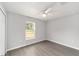 Well-lit bedroom with gray flooring and a ceiling fan that offers both comfort and style at 4919 Nw 61St Ct, Ocala, FL 34482
